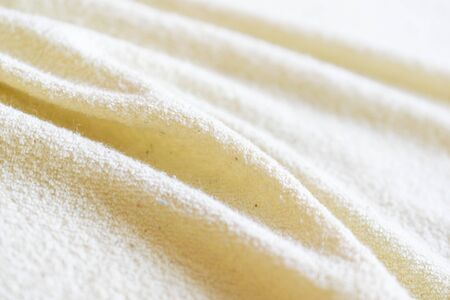 wrinkled creamy cotton material. texturaの写真素材