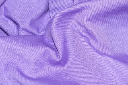 creased purple material texture or background.の写真素材