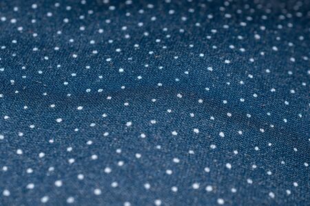 blue fabric with white dots.の写真素材