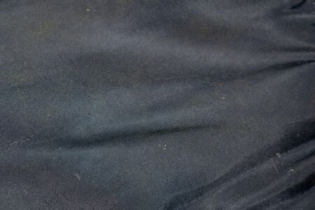 black crinkled fabric texture or background.の写真素材