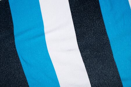 striped background made of fabric and textiles blue and white and black color.の写真素材