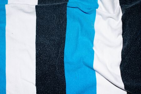 striped background made of fabric and textiles blue and white and black color.