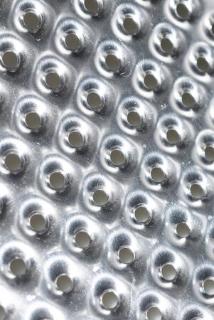 silver sheet with round holes.