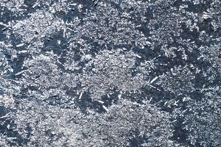 ice crystals on a black wallの写真素材
