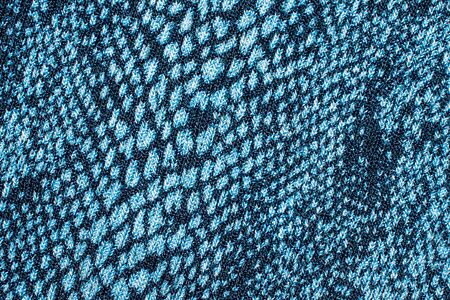 The texture of the knitted blue fabric for the backgroundの写真素材