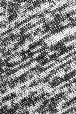 The texture of the knitted gray fabric for the backgroundの写真素材