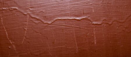 old metal plate painted with brown paint.の写真素材