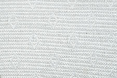 white cotton material with diamond-shaped patternsの写真素材