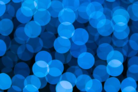 Abstract blue bokeh texture on black backgroundの写真素材