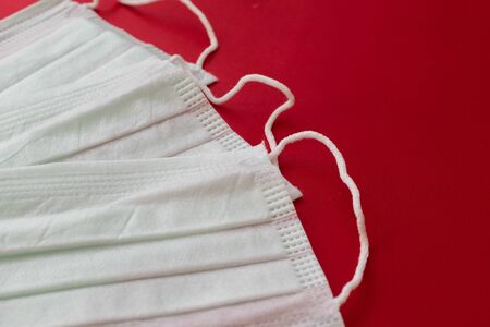 medical mask on a red background. protection against virusesの写真素材