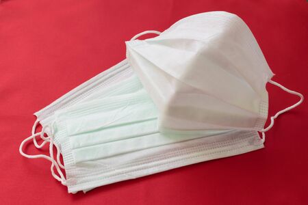 medical mask on a red background. protection against virusesの写真素材