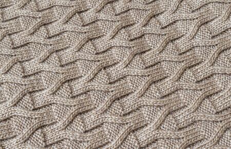 The texture of the knitted brown fabric for the backgroundの写真素材