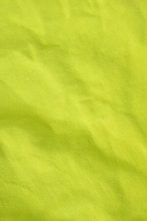 wrinkled green cotton material. texture or backgroundの写真素材