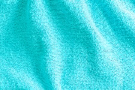 wrinkled blue wool material. texture or backgroundの写真素材
