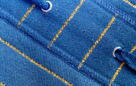 blue cotton material with golden lines. texture or backgroundの写真素材