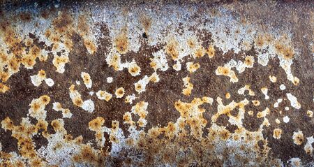 old rusting metal painted with white paint
