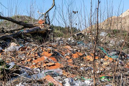 Municipal garbage dump in landfill. Environmental pollution.の写真素材