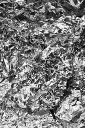 crumpled silver baking foil. texture or backgroundの写真素材
