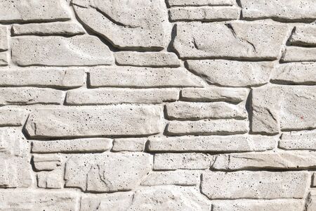 white artificial stone with visible details. texture or backgroundの写真素材