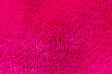 pink woolen material with visible details. backgroundの写真素材