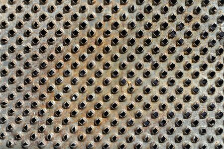 Close-up of metal with holes. texture or backgroundの写真素材