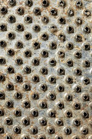 Close-up of metal with holes. texture or backgroundの写真素材