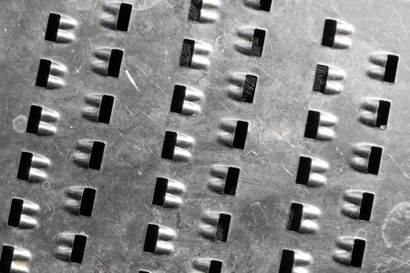 Close-up of metal with holes. texture or background