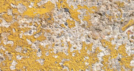 old wall painted with yellow paint. texture or background