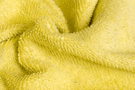 yellow cotton material with visible details. texture or backgroundの写真素材