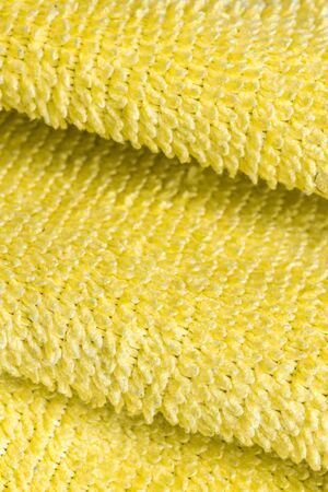 yellow cotton material with visible details. texture or backgroundの写真素材