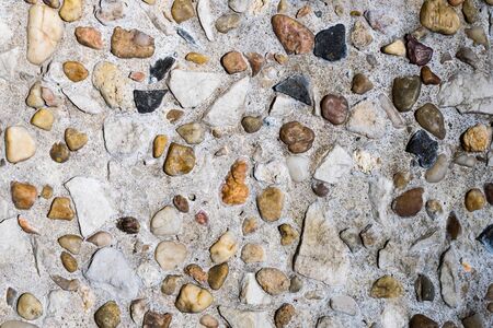 brown wall texture. small pebbles.の写真素材