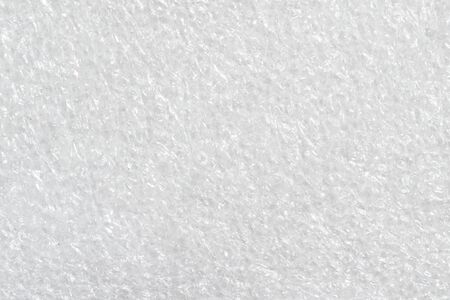 white wrinkled foil with visible details. texture or backgroundの写真素材