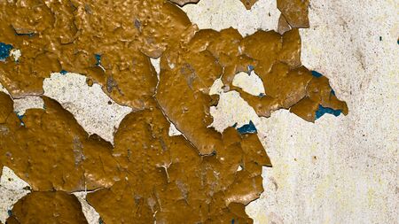 old orange paint peeling off the wall.の写真素材