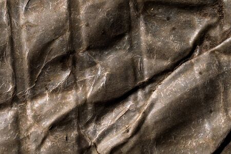 the old rusted creased sheet metal