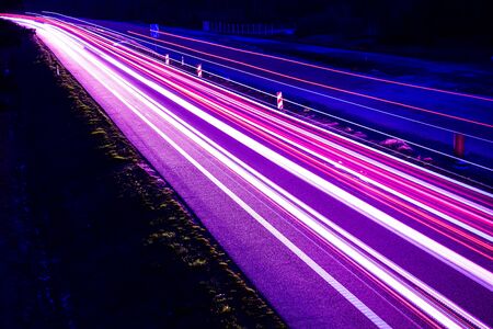 violet car lights at night. long exposure