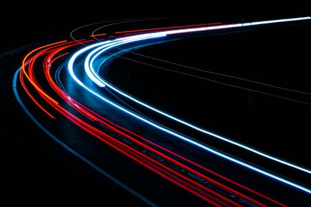 car lights at night on the roadの写真素材