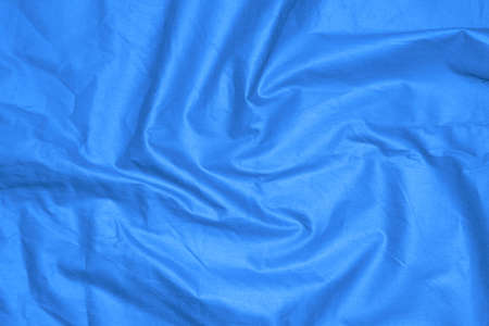 crinkled blue material texture or background.の写真素材