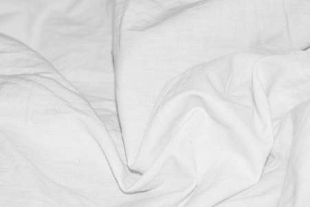 pleated white cotton material. texture or background
