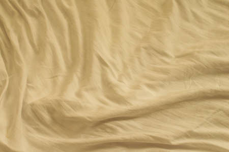 pleated creamy cotton material. texture or backgroundの写真素材