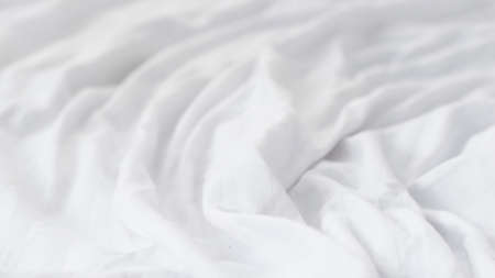 pleated white cotton material. texture or backgroundの写真素材