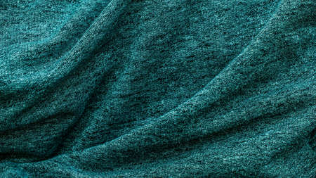 crinkled green cotton fabric. backgroundの写真素材