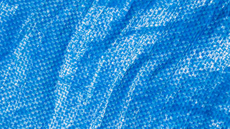 blue plastic bag surface. texture or backgroundの写真素材