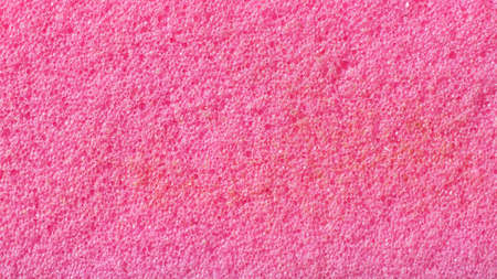 pink washing sponge with visible detailsの写真素材