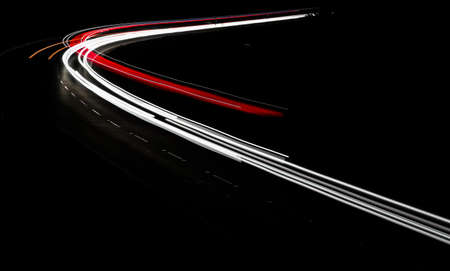 colorful lights of cars at nightの写真素材