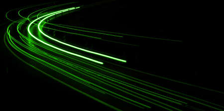 abstract green car lights at nightの写真素材