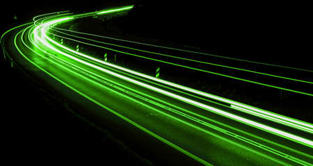 abstract green car lights at nightの写真素材