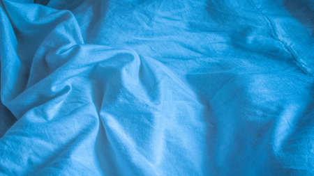 pleated blue cotton material. texture or backgroundの写真素材