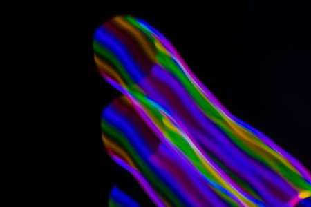 multicolored rainbow lines on black background