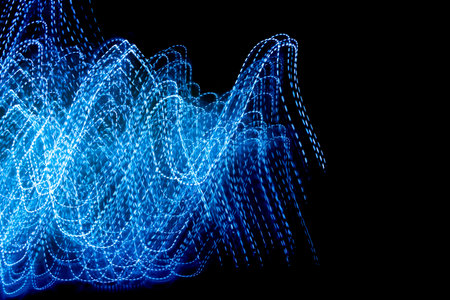 blue dashed lines of lights on a black background