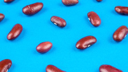 red beans with a visible texture on a blue backgroundの写真素材